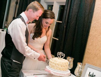 cutting cake for the bride and groom to take photos. it helps to save on cost.