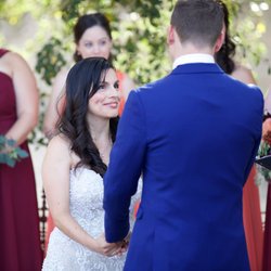 During the ceremony, your photographer will be capturing the perfect moments. I love this photo, with the bride gazing up at her soon to be husband, full of love and adoration. Their fall wedding colors of burgundy, rust, and coral were perfectly accented by the groom's royal blue suit. 